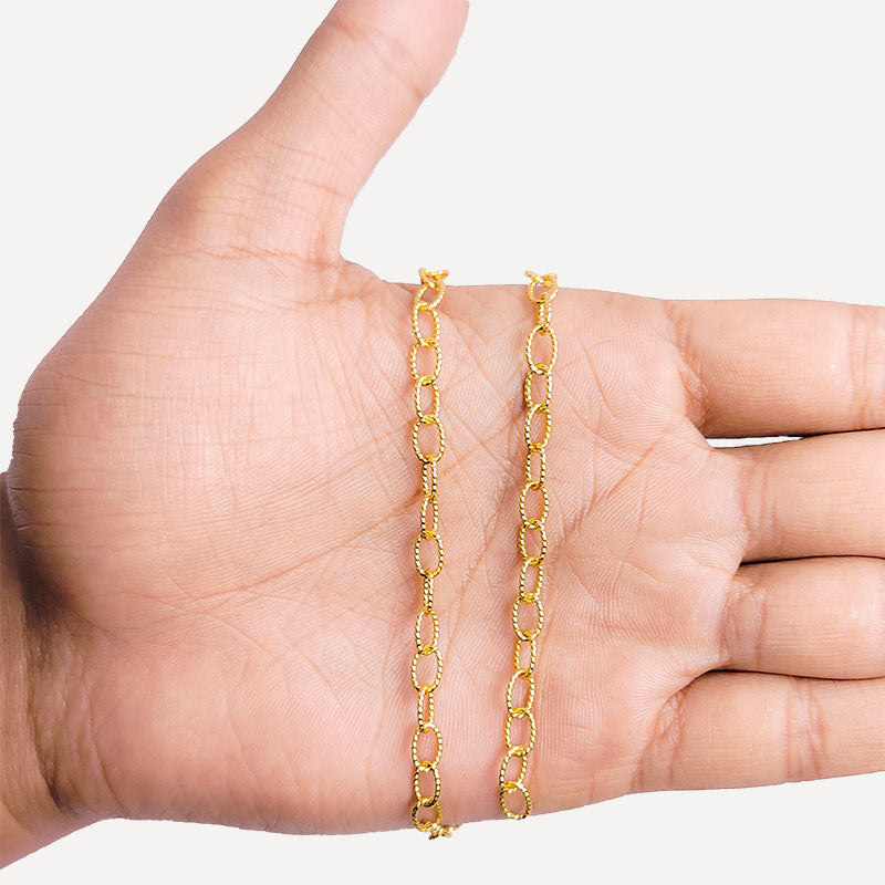 Textured oval link chain made with 18K Gold Overlay Over Copper featuring oversized polished links, twisted detailing, and flexible length sold per foot for custom jewelry projects
