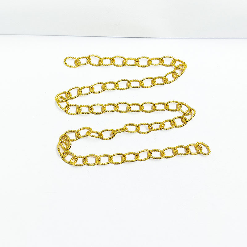 Textured oval link chain made with 18K Gold Overlay Over Copper featuring oversized polished links, twisted detailing, and flexible length sold per foot for custom jewelry projects