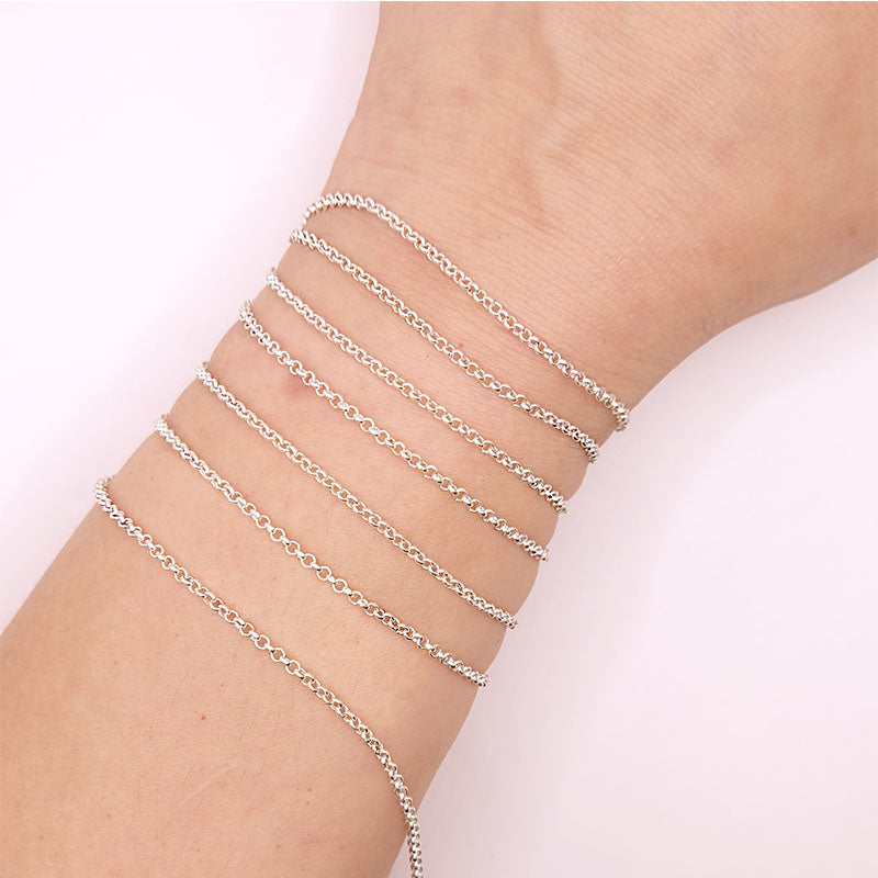 Silver overlay over copper round link chain with polished finish and elegant smooth circular links displayed on white background for retail jewelry use