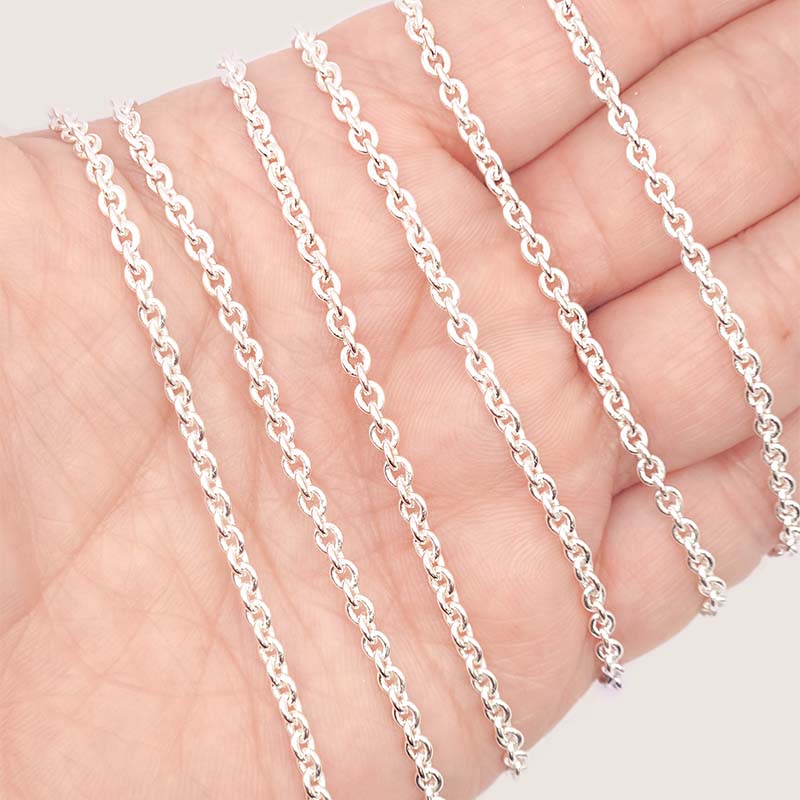 Silver overlay over copper round link chain with polished finish and elegant smooth circular links displayed on white background for retail jewelry use
