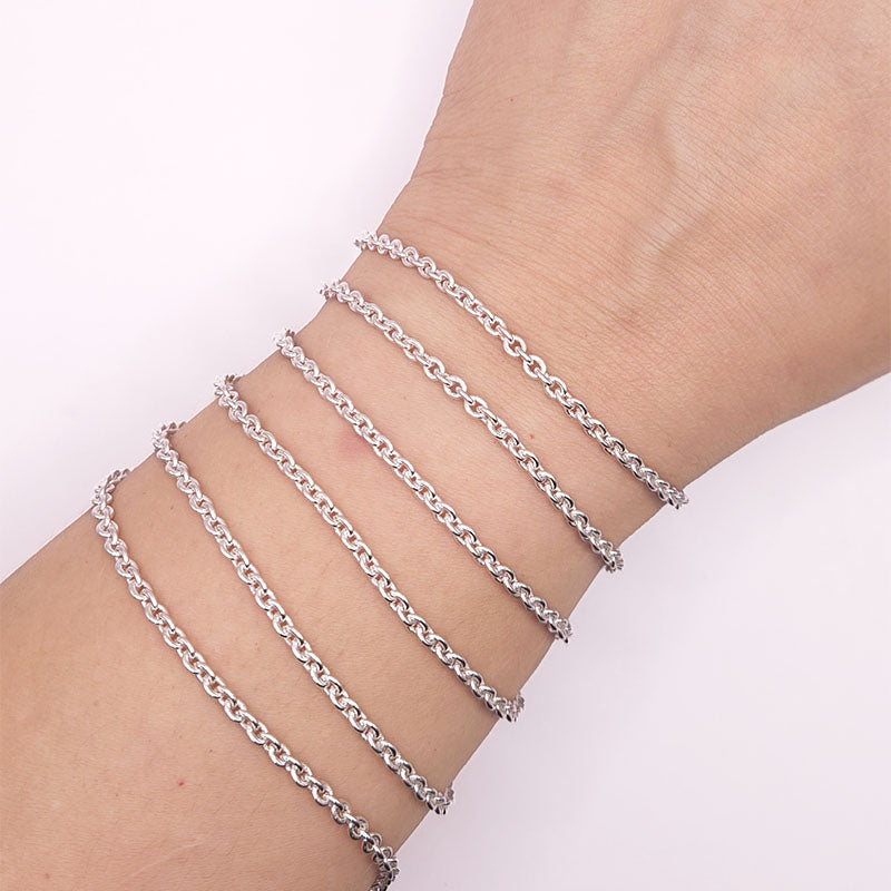 Silver overlay over copper round link chain with polished finish and elegant smooth circular links displayed on white background for retail jewelry use