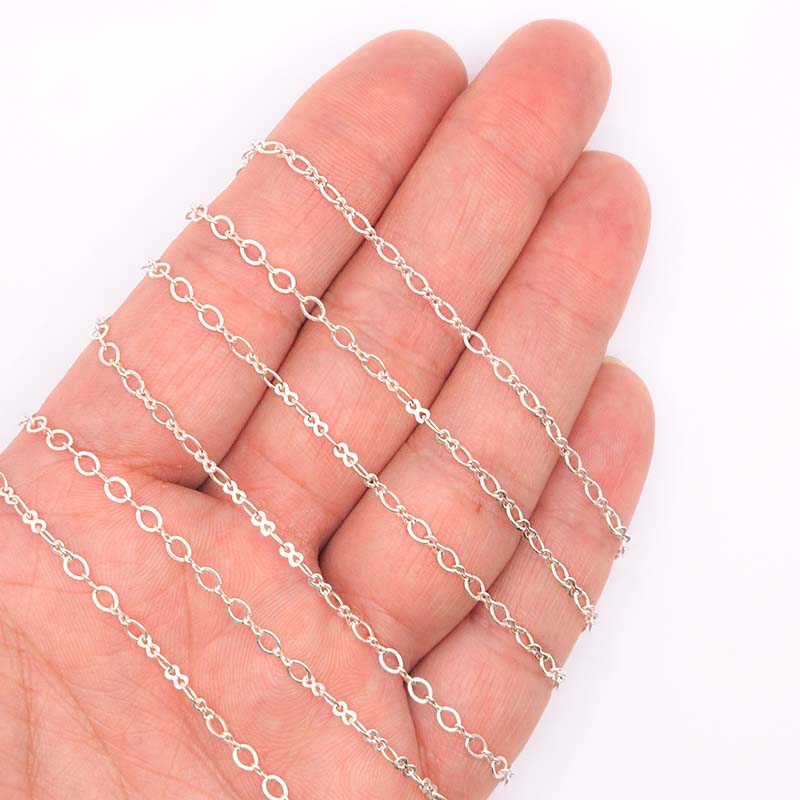 Silver overlay over copper mixed link chain with polished finish and elegant alternating links displayed on white background for retail jewelry use