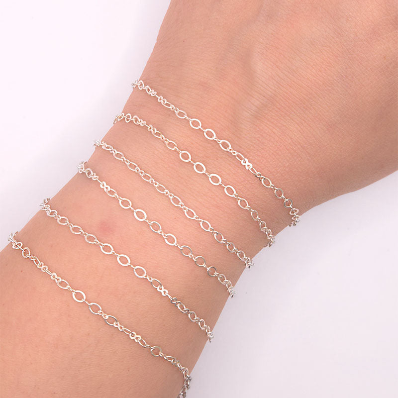 Silver overlay over copper mixed link chain with polished finish and elegant alternating links displayed on white background for retail jewelry use