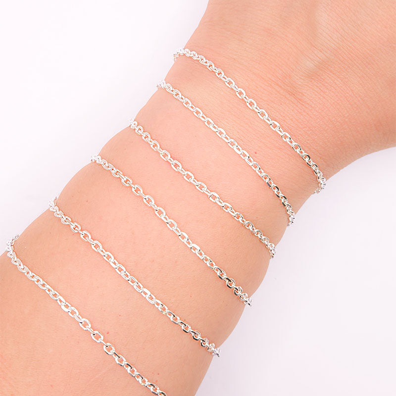 Silver overlay over copper fine oval link chain with polished finish and elegant compact oval links displayed on white background for retail jewelry use