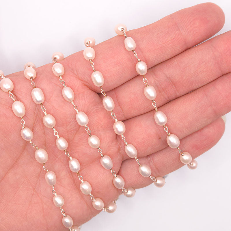 Silver overlay over copper mabe pearl beading and extender chain with polished finish and oval luminous pearl beads displayed on white background for retail jewelry use