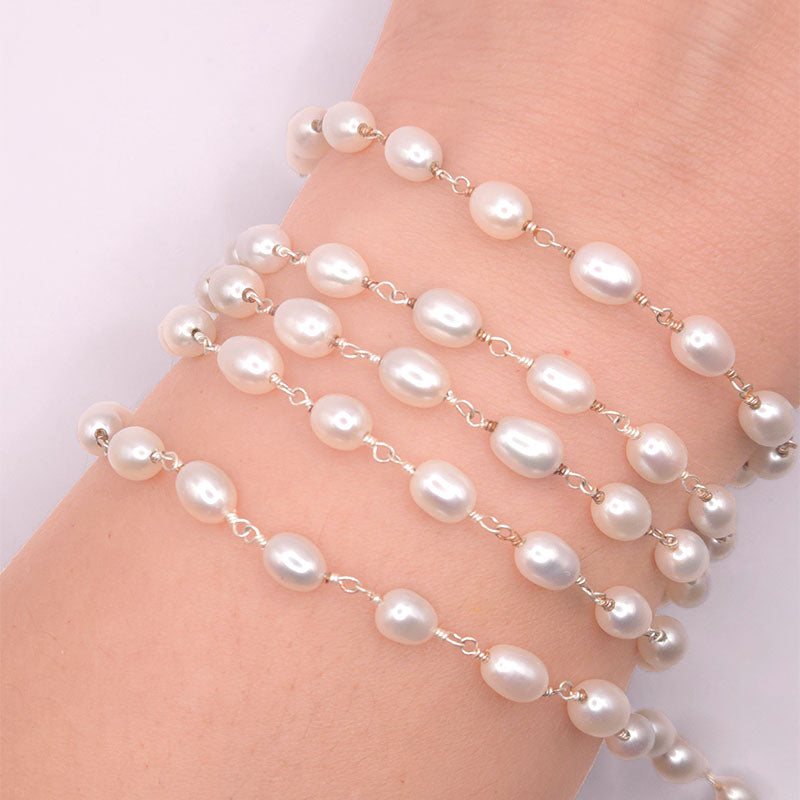 Silver overlay over copper mabe pearl beading and extender chain with polished finish and oval luminous pearl beads displayed on white background for retail jewelry use
