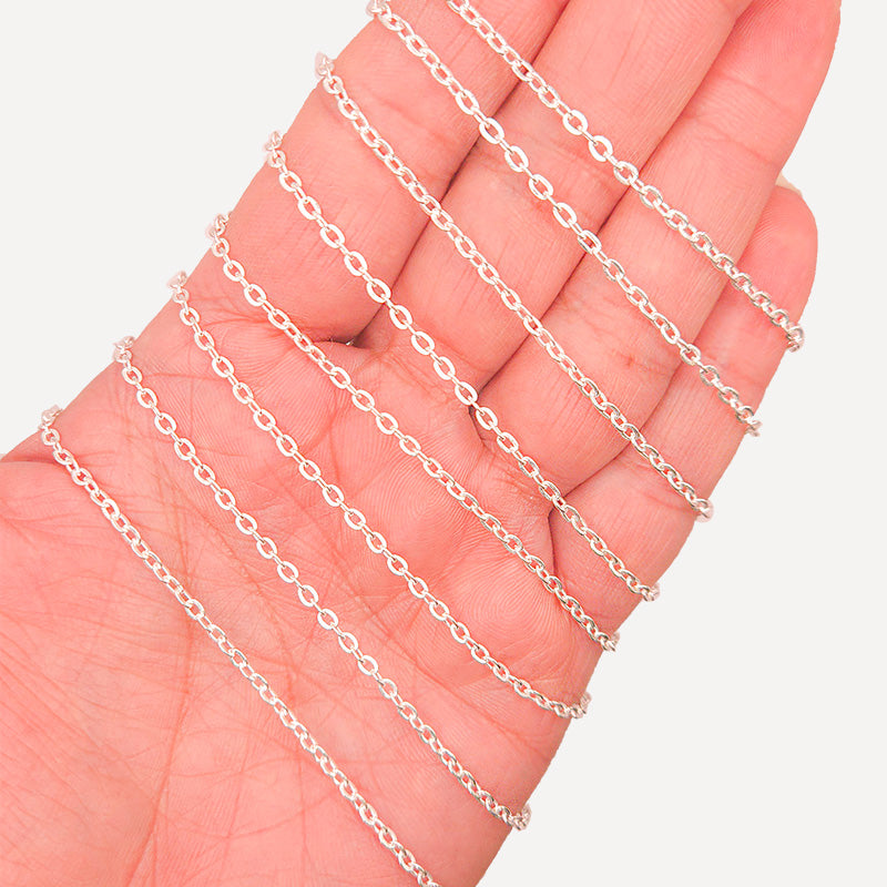 Silver overlay over copper beading and extender chain with polished oval links shown on white background for retail jewelry styling and customization