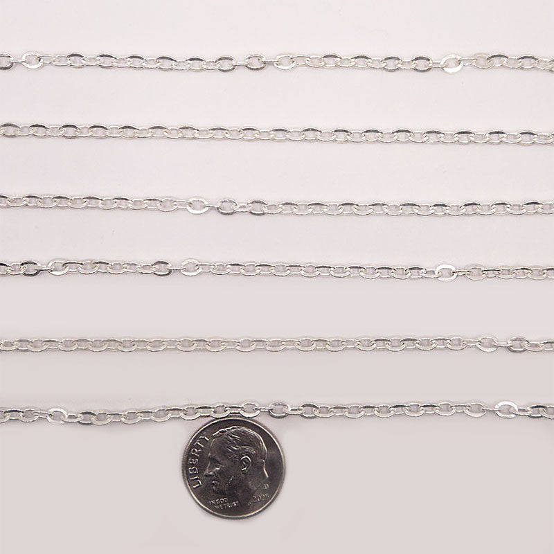 Silver overlay over copper beading and extender chain with polished oval links shown on white background for retail jewelry styling and customization