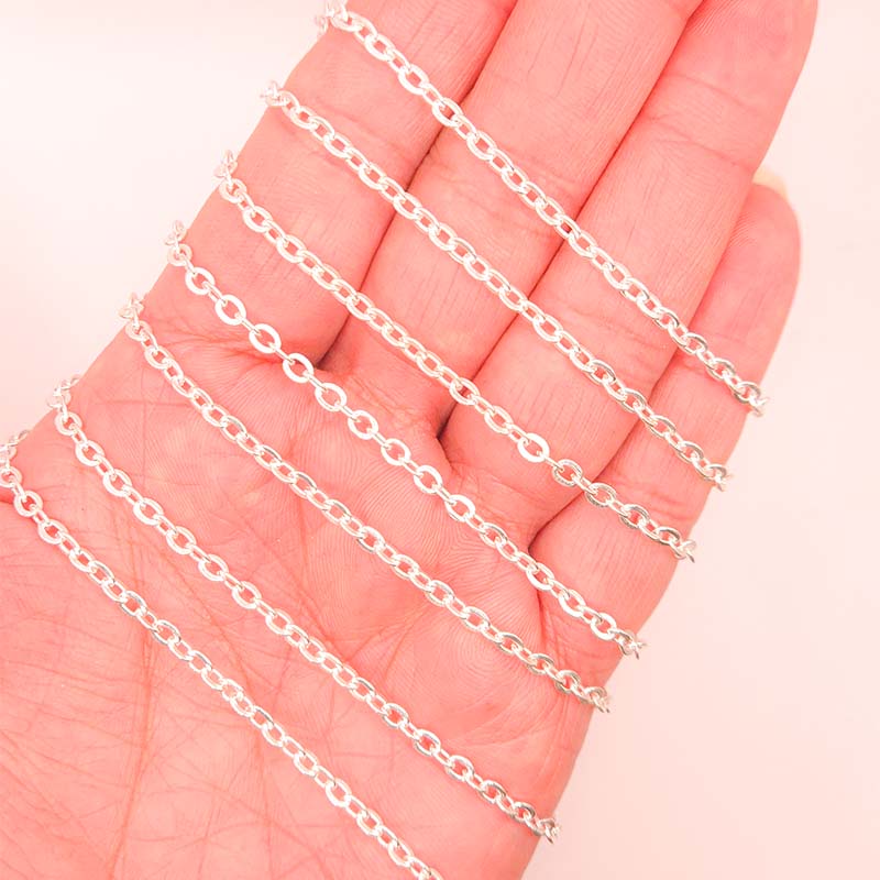 Silver overlay over copper beading and extender chain with polished oval links shown on white background for retail jewelry styling and customization