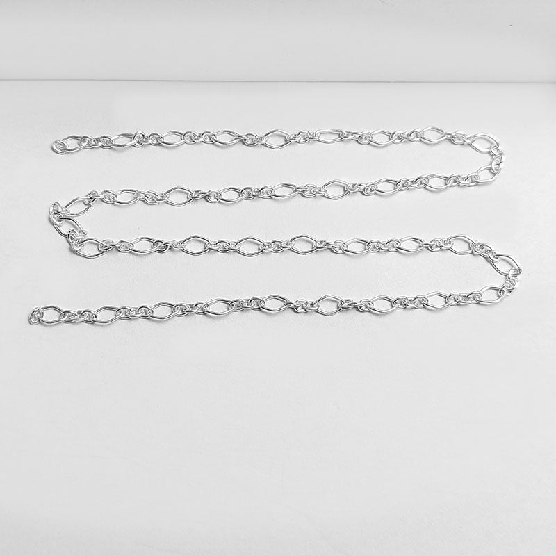 Silver Overlay Over Copper alternating oval link beading and extender chain sold as per foot, ideal for creating custom necklaces, bracelets, and layered jewelry designs