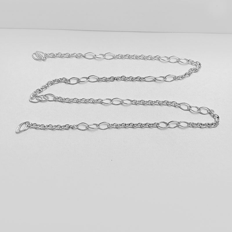 Silver Overlay Over Copper graduated oval link beading and extender chain sold as per foot, ideal for creating custom necklaces, bracelets, and layered jewelry designs