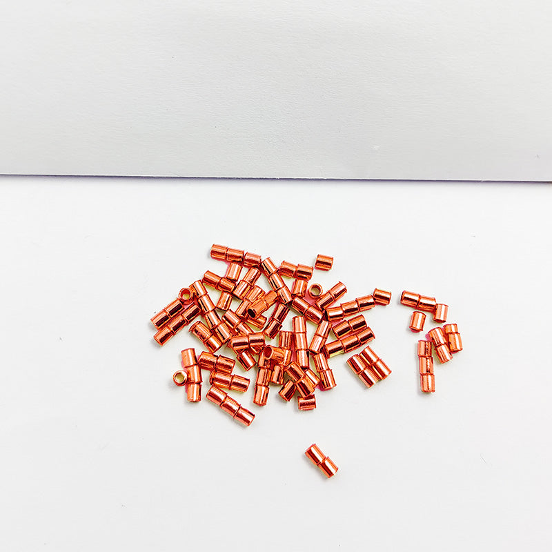 Round crimp bead made from Rose Gold Overlay Over Copper with smooth polished surface, ideal for handmade jewelry designs requiring clean and secure closures