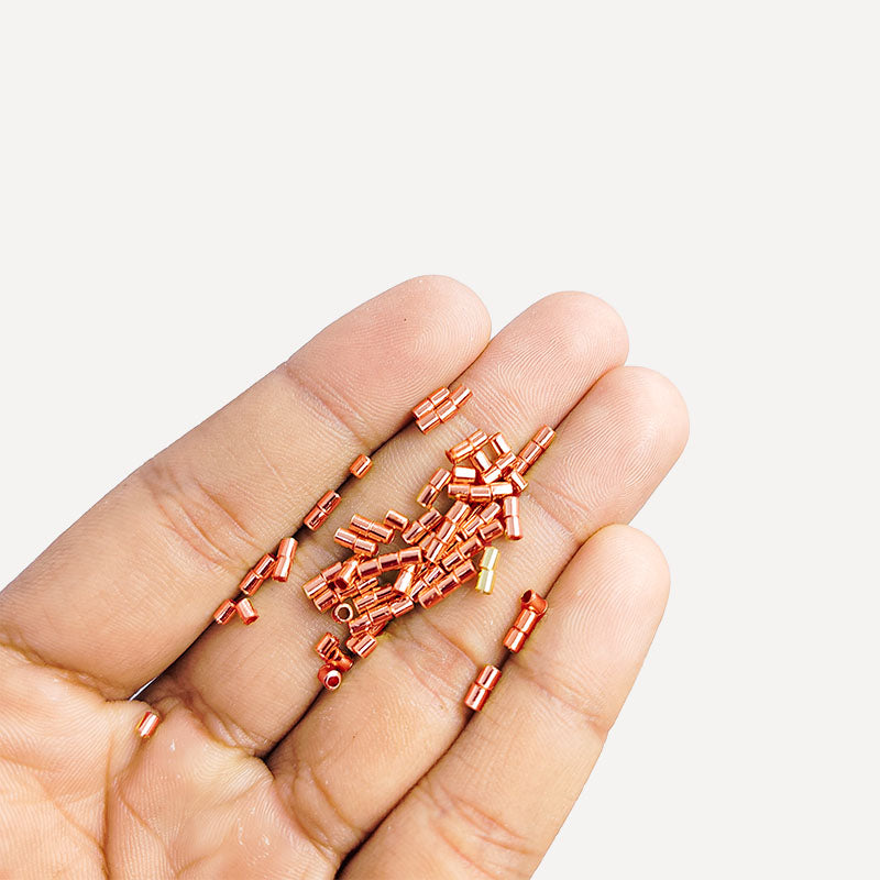 Round crimp bead made from Rose Gold Overlay Over Copper with smooth polished surface, ideal for handmade jewelry designs requiring clean and secure closures