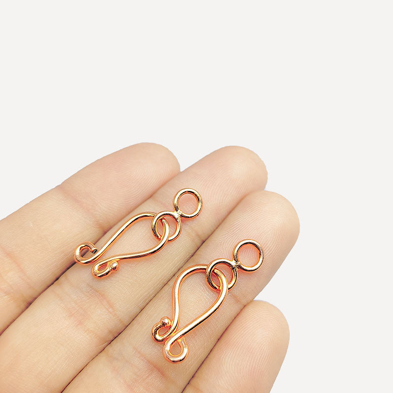 Curved hook component made from Rose Gold Overlay Over Copper with smooth polished finish, ideal for handmade jewelry designs requiring secure and elegant connections