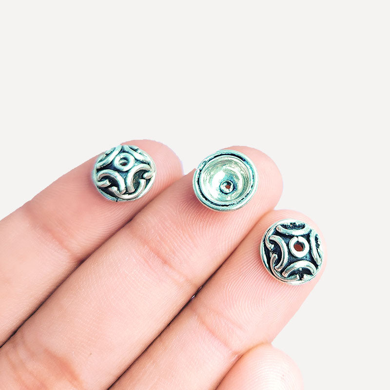 Silver overlay over copper bead cap from India with handcrafted swirl pattern and oxidized silver finish