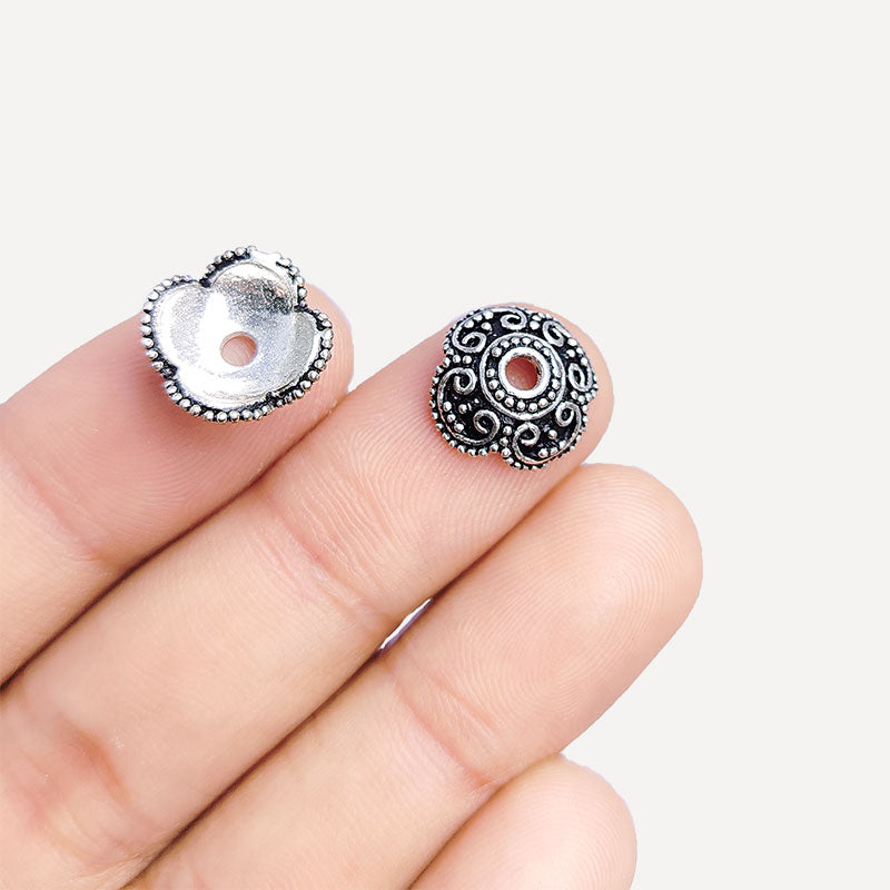 Silver overlay over copper bead cap from India with handcrafted scroll and dotted pattern in oxidized silver finish