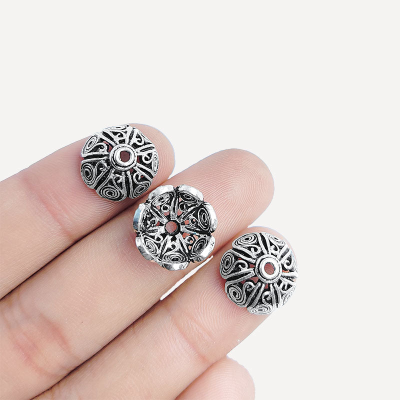 Silver overlay over copper bead cap from India handcrafted with swirl petal design and oxidized silver finish