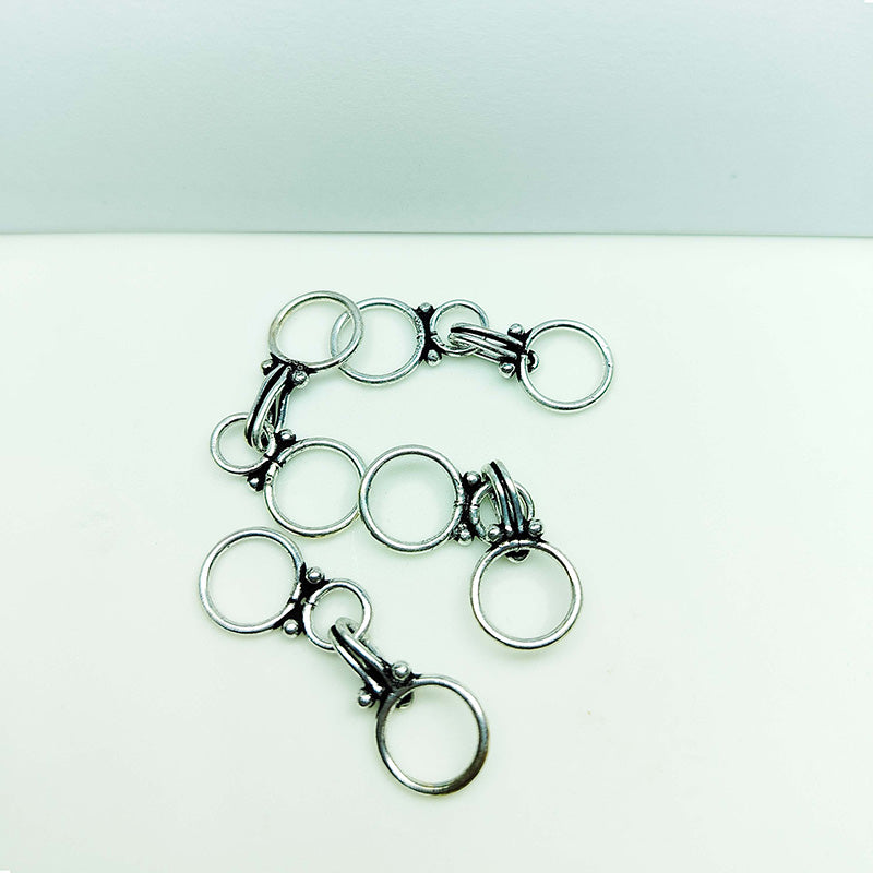 Silver overlay over copper clasp hook from India handcrafted with oval hook design and polished silver finish