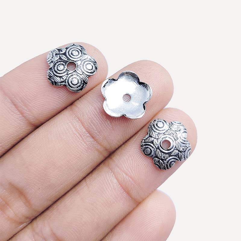 Elegant antique silver overlay over copper floral bead cap handcrafted in India for retail jewelry designs