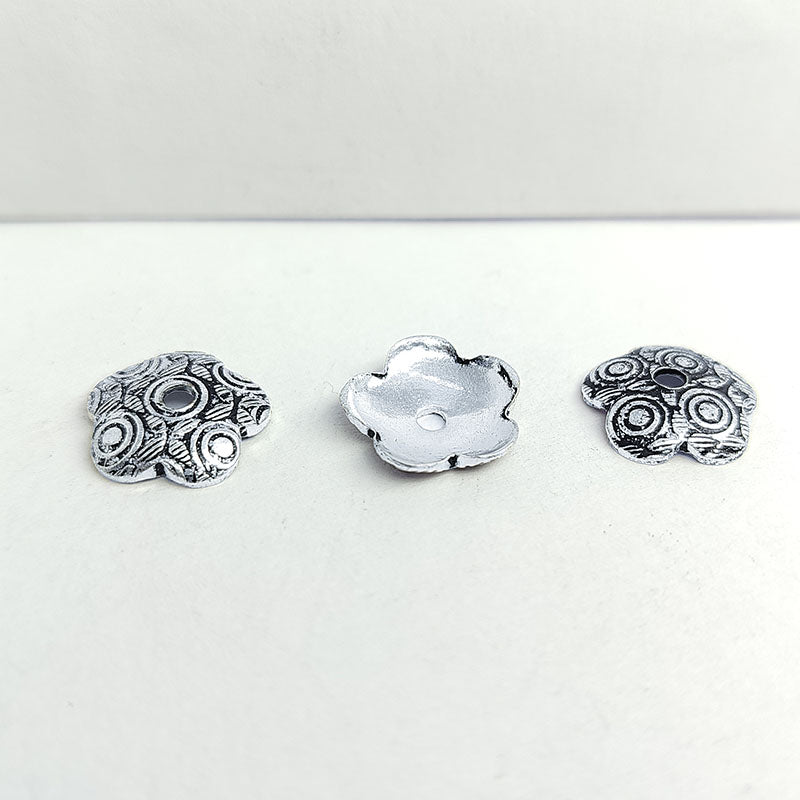 Elegant antique silver overlay over copper floral bead cap handcrafted in India for retail jewelry designs