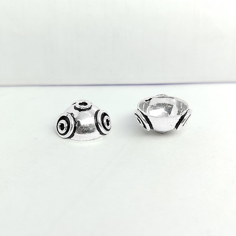 Silver Overlay over Copper vintage Bali bead cap from India with raised circular design and antique finish.