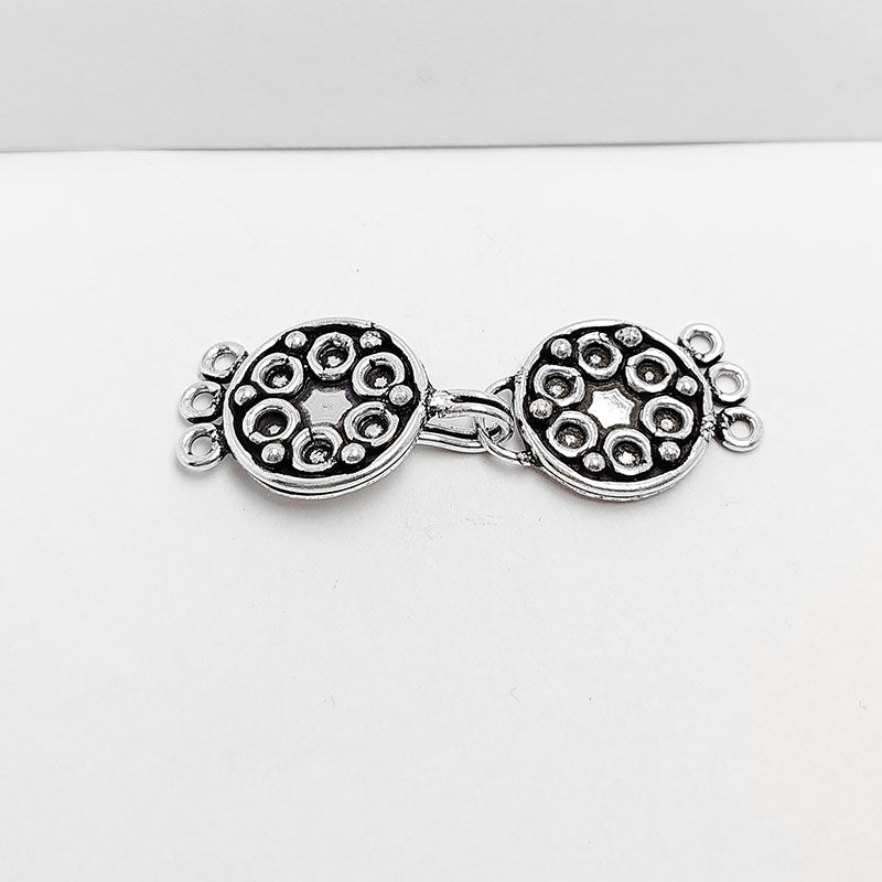 Silver Overlay over Copper round multi strand clasp with 3 holes handcrafted in India featuring star motif and antique finish.