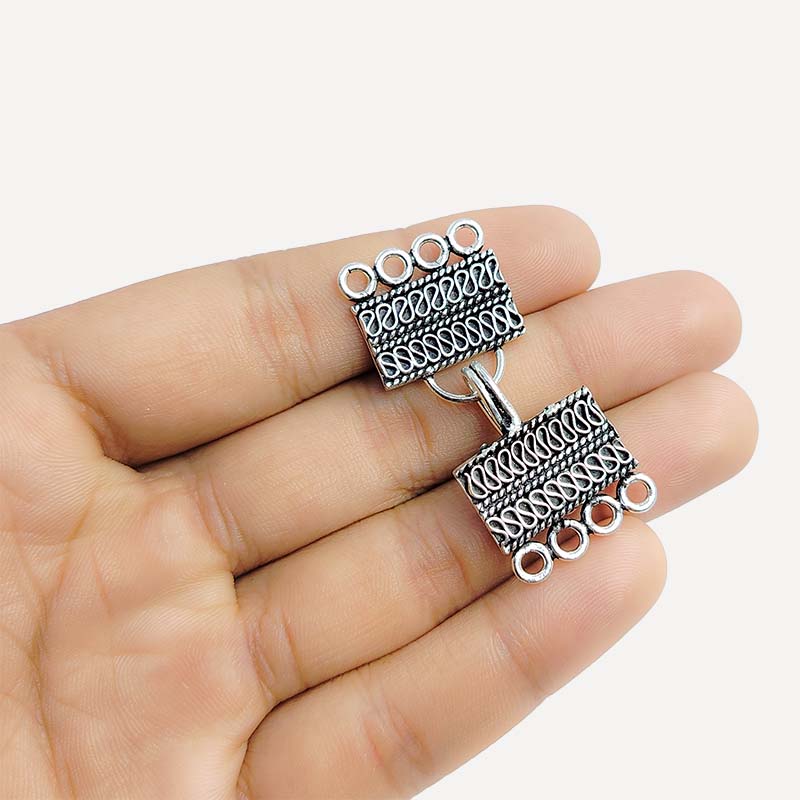 Silver Overlay over Copper rectangular multi strand clasp with 4 holes handcrafted in India featuring Bali wave detailing and antique finish.