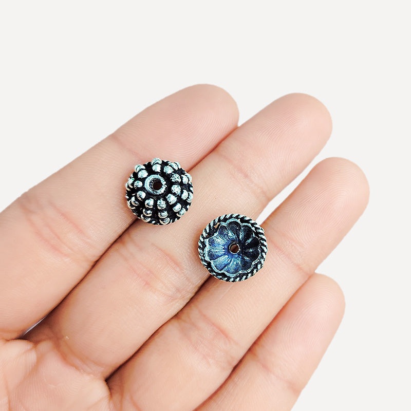 Silver Overlay Over Copper India floral textured bead cap with center hole and oxidized finish.