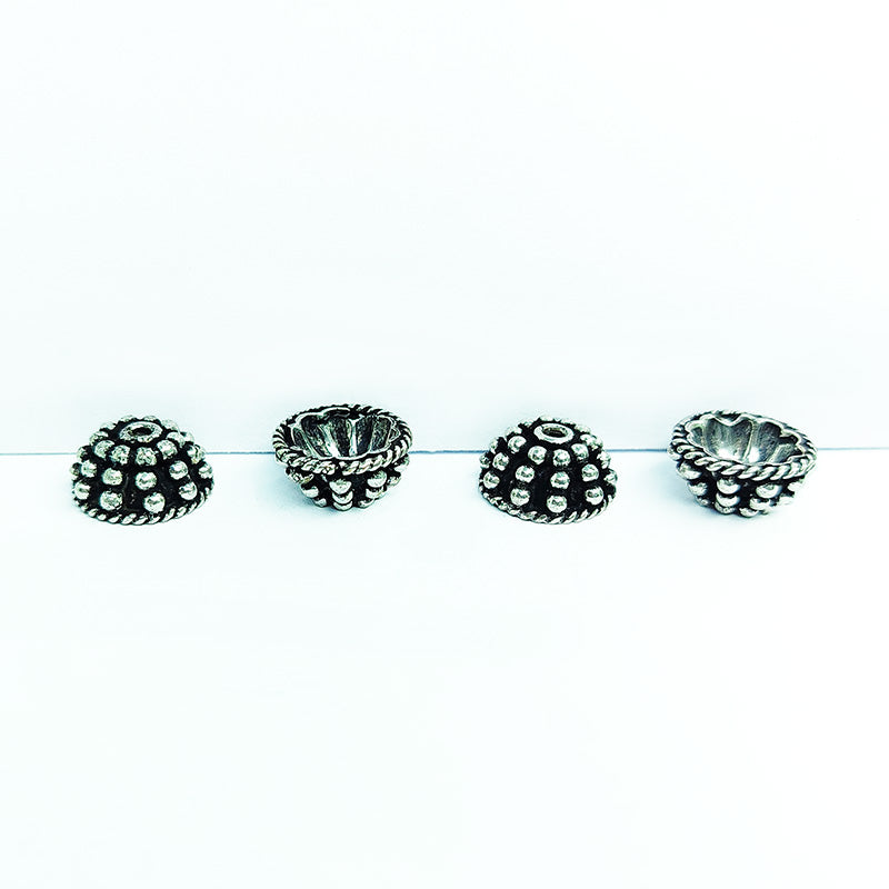 Silver Overlay Over Copper India floral textured bead cap with center hole and oxidized finish.