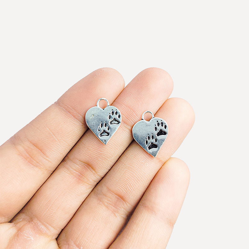 Silver Overlay Over Copper India heart paw print charm with antique finish.