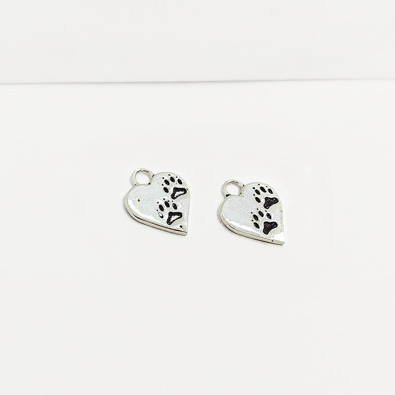 Silver Overlay Over Copper India heart paw print charm with antique finish.