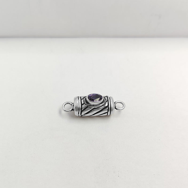 Polished silver overlay connector pendant with oval purple stone crafted from silver overlay over copper in India.