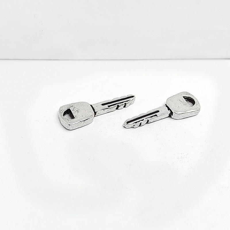 Silver Overlay Over Copper little key charms handcrafted in India with vintage oxidized detailing.