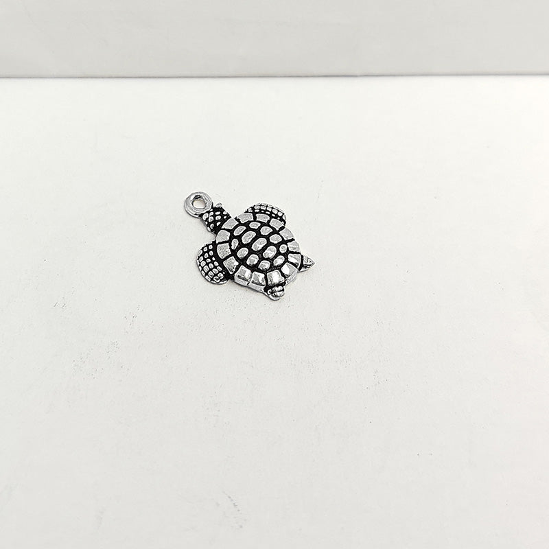 Silver Overlay Over Copper turtle pendant handcrafted in India with vintage oxidized detailing.