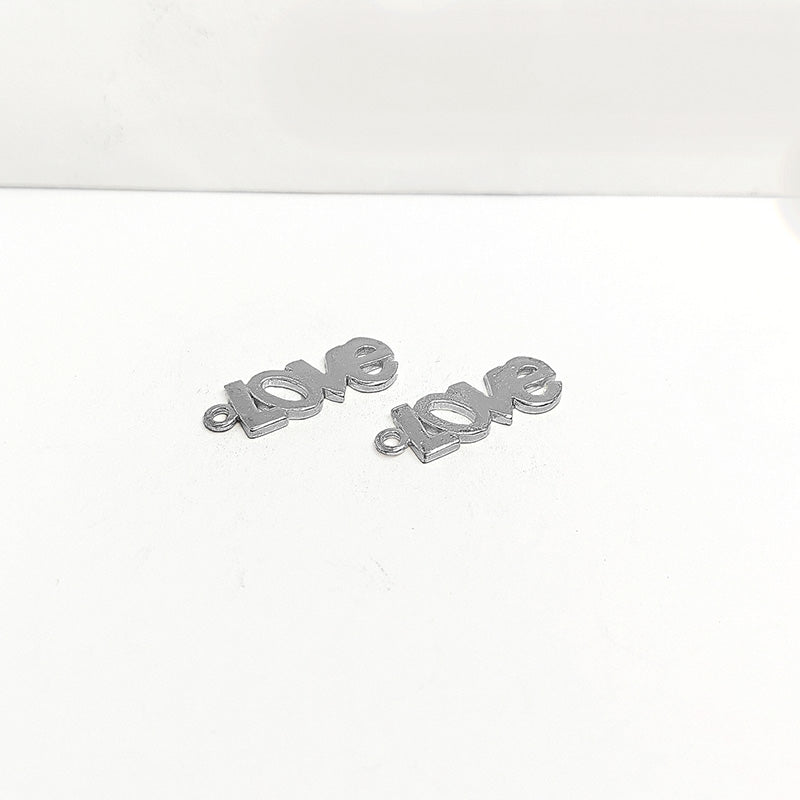 Silver Overlay Over Copper Love script charm handcrafted in India with vintage oxidized finish.