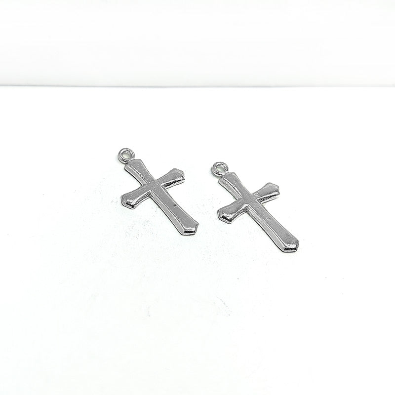 Handcrafted silver overlay over copper cross charm pendant from India with simple minimalist design