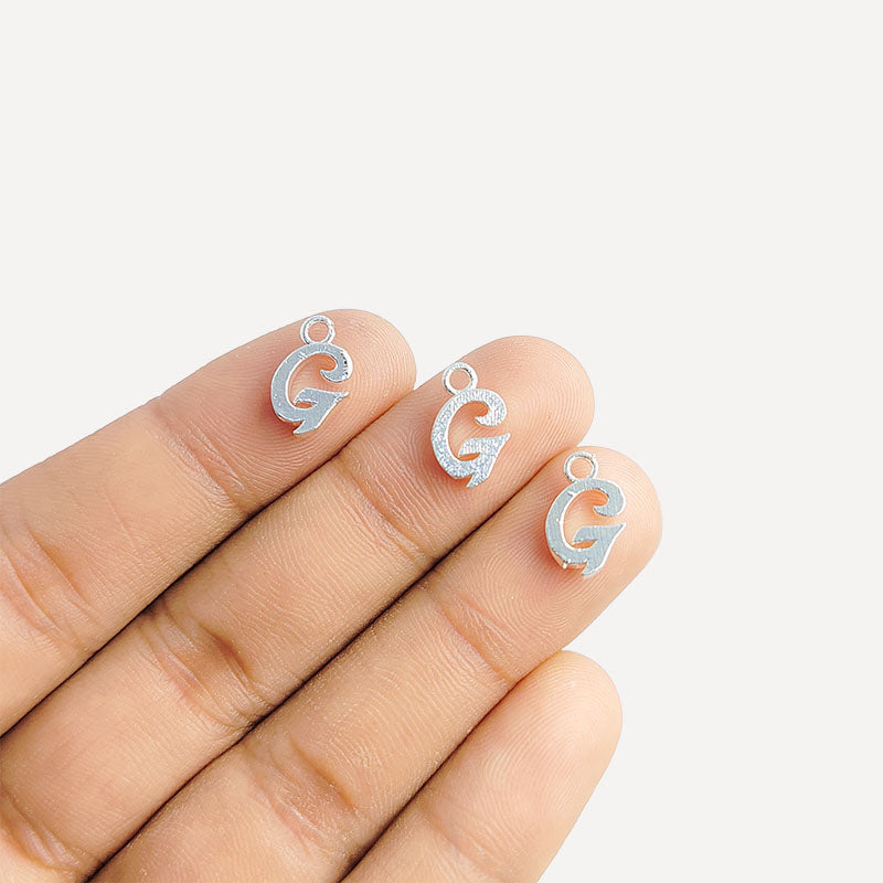 Silver overlay over copper alphabet G Charm with script design, handcrafted in India for personalized jewelry