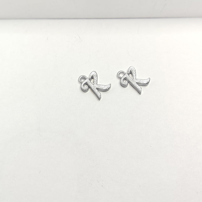 Silver overlay over copper alphabet K pendant with decorative design, handcrafted in India for personalized jewelry