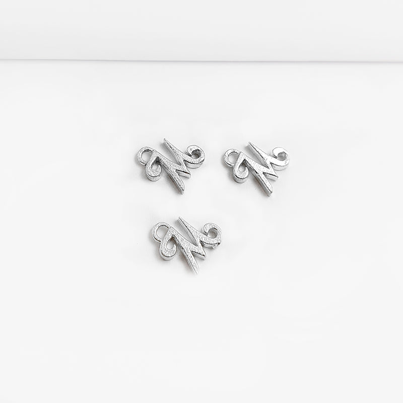 Silver overlay over copper alphabet M Charm with textured design, handcrafted in India for personalized jewelry