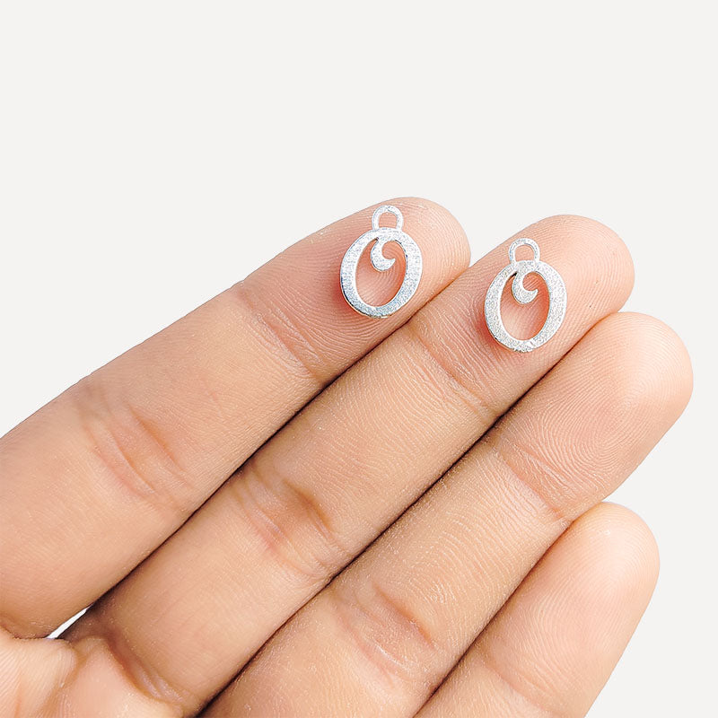 Handcrafted Silver Overlay Over Copper alphabet “O” charm from India with polished textured finish for handmade personalized jewelry.