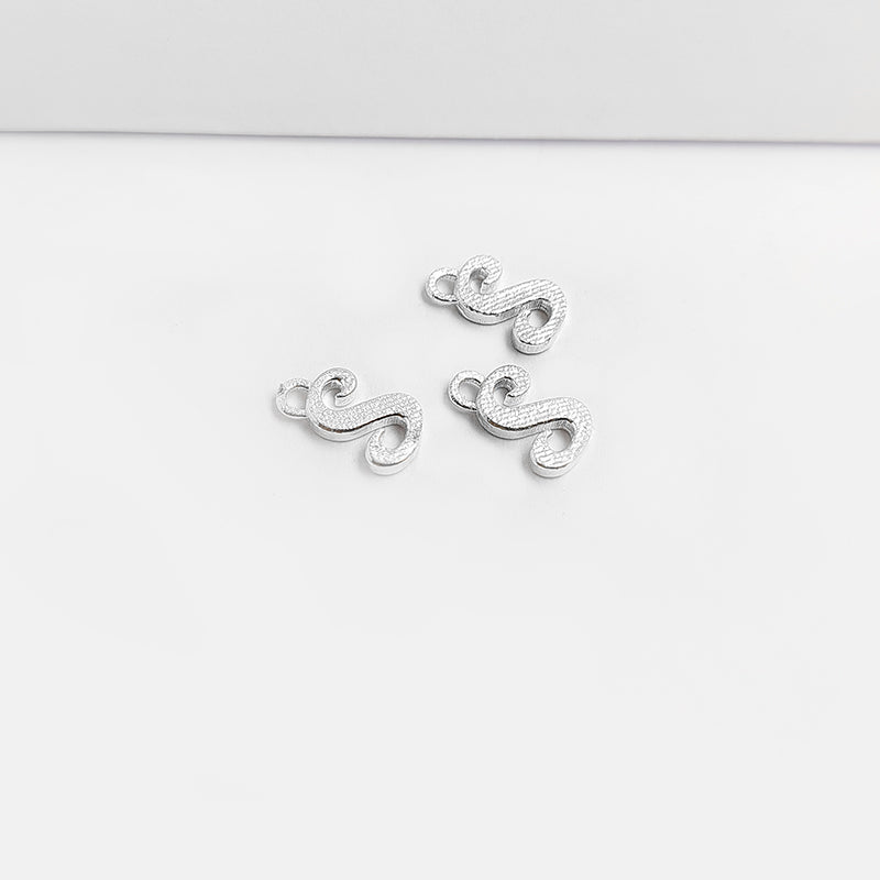 Handcrafted Silver Overlay Over Copper alphabet “S” charm from India with polished textured finish for handmade jewelry.