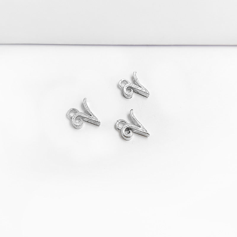 Handcrafted Silver Overlay Over Copper alphabet “V” charm from India with polished textured finish for handmade jewelry.