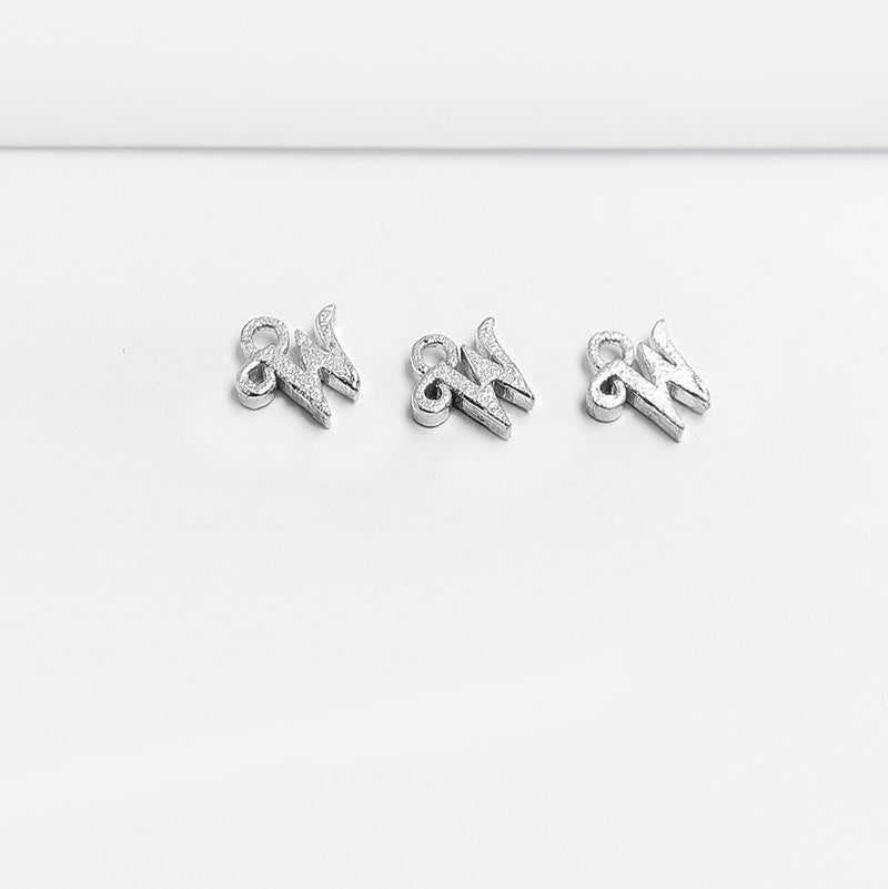 Handcrafted Silver Overlay Over Copper alphabet “W” charm from India with polished silver finish for handmade jewelry projects.