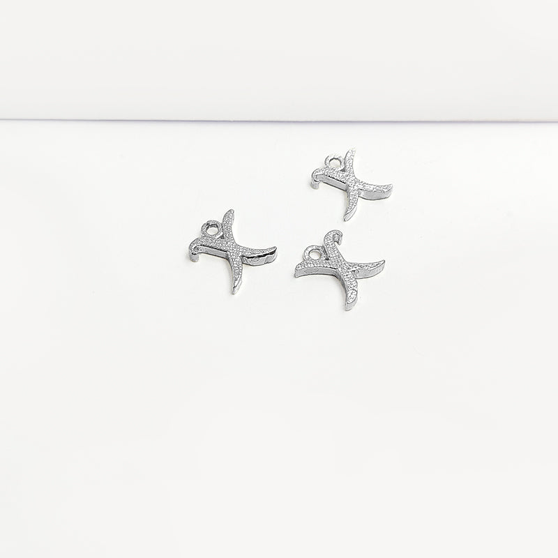 Handcrafted Silver Overlay Over Copper alphabet “X” charm from India with polished textured finish for handmade jewelry.