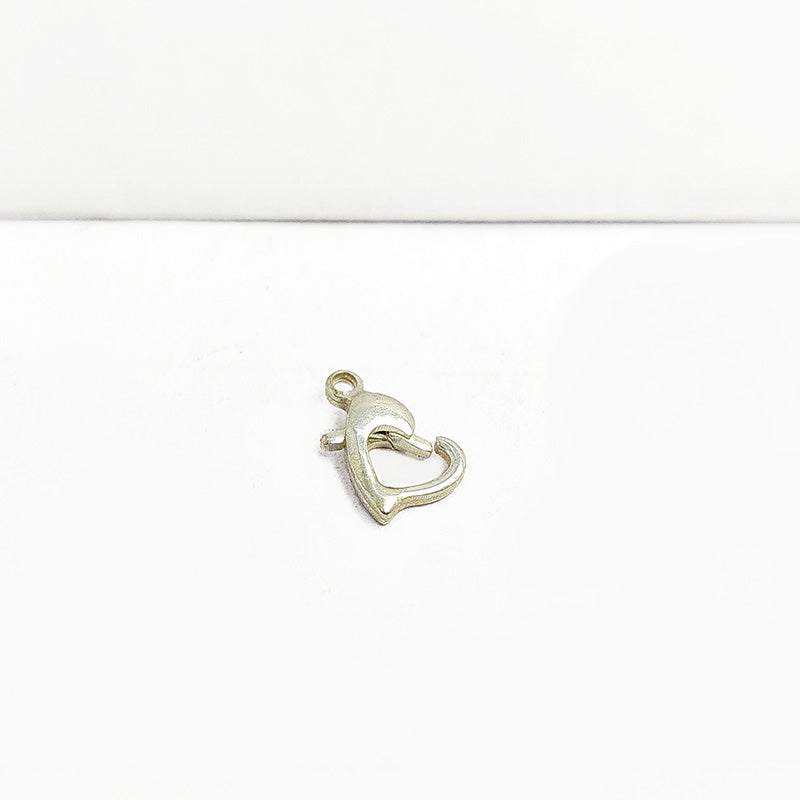 Handmade silver overlay over copper heart shape lobster clasp from India with polished finish for jewelry making.