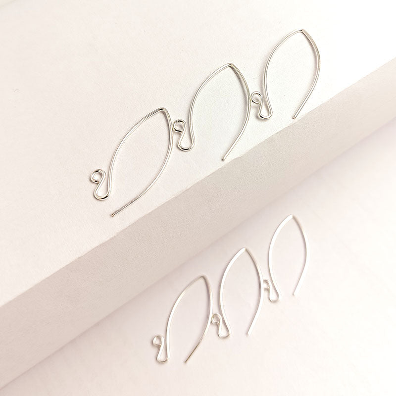 Stylish silver overlay earring wires featuring an elongated marquis shape for DIY jewelry making and unique accessory designs.