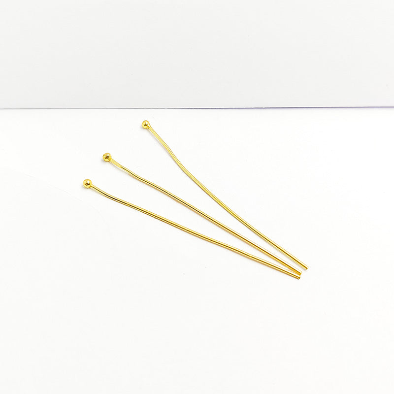 Elegant polished gold-overlay copper pin handcrafted in India with a rounded tip.