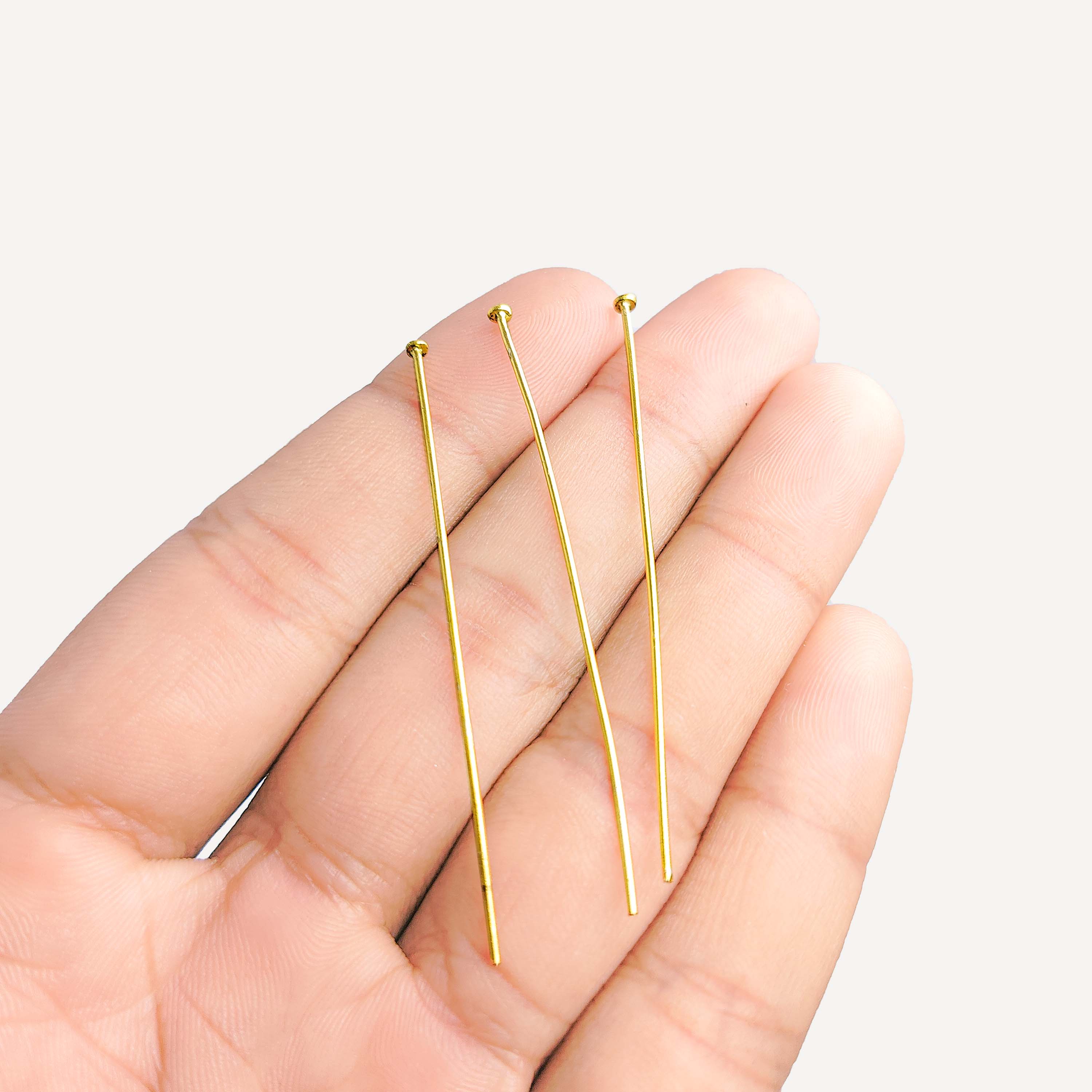 Polished flat-head gold-overlay copper pin handcrafted in India.