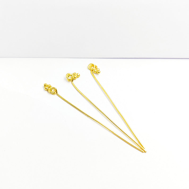 Artistic 18K gold overlay granulated eye pin handcrafted in India.