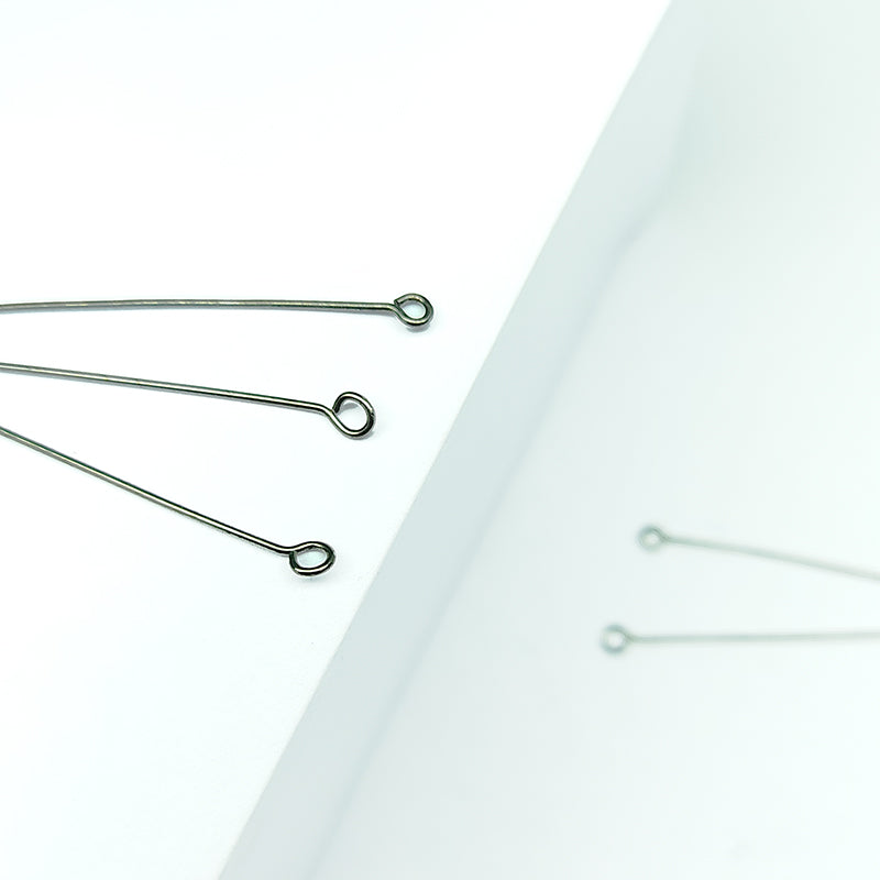 India handcrafted eye pin with black rhodium overlay over copper for retail jewelry crafting.